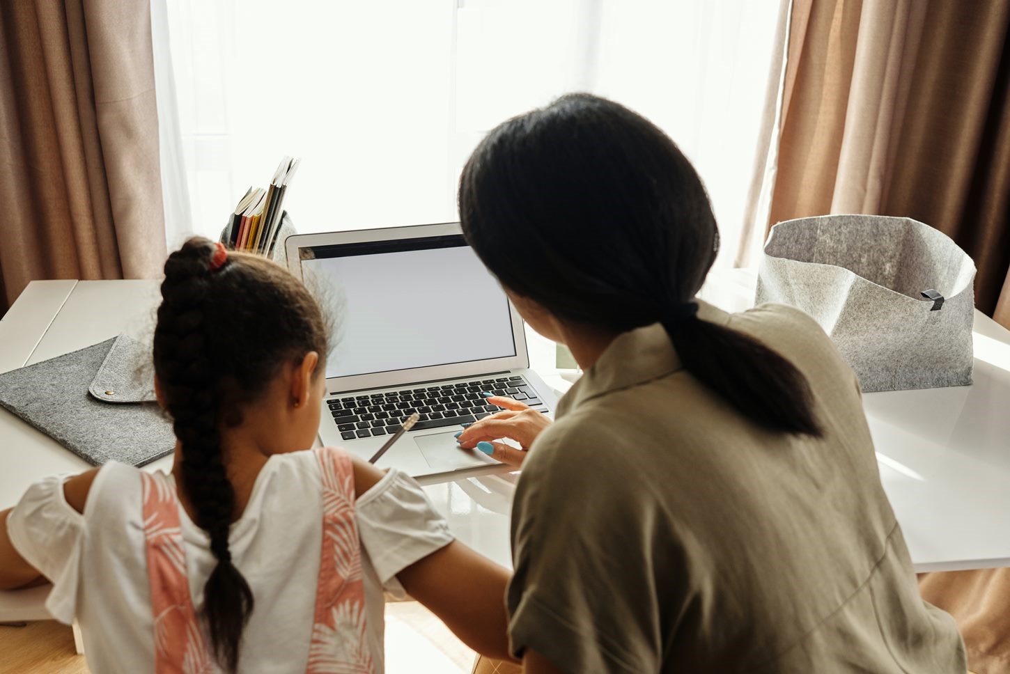 Mom working from home with child