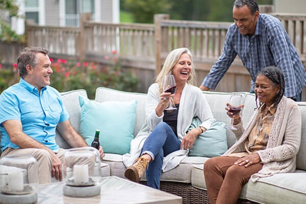 Couples gathering on outside patio area in Embrey Mill.